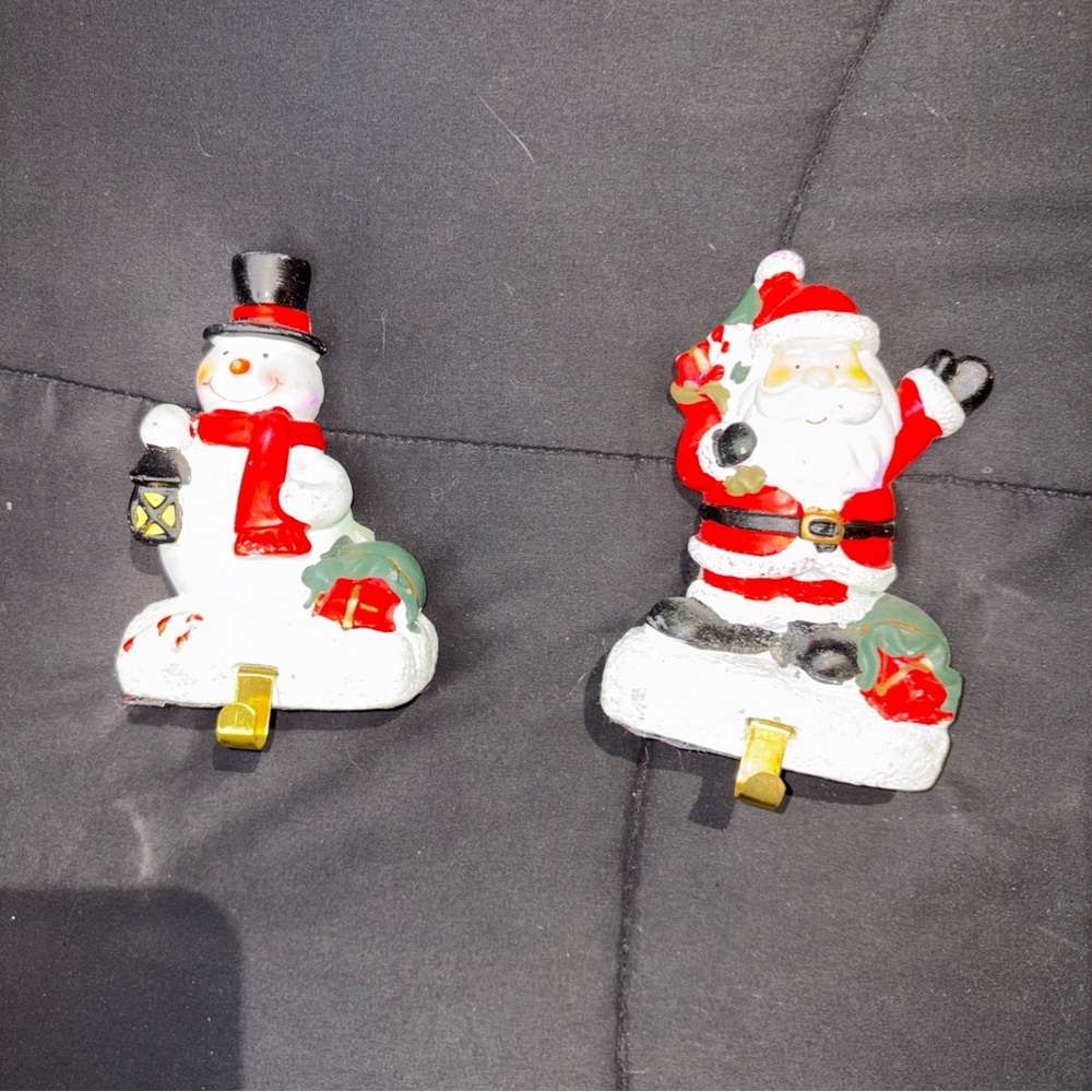 Two greenbrier ceramic  Santa and Snowman Stocking Holders